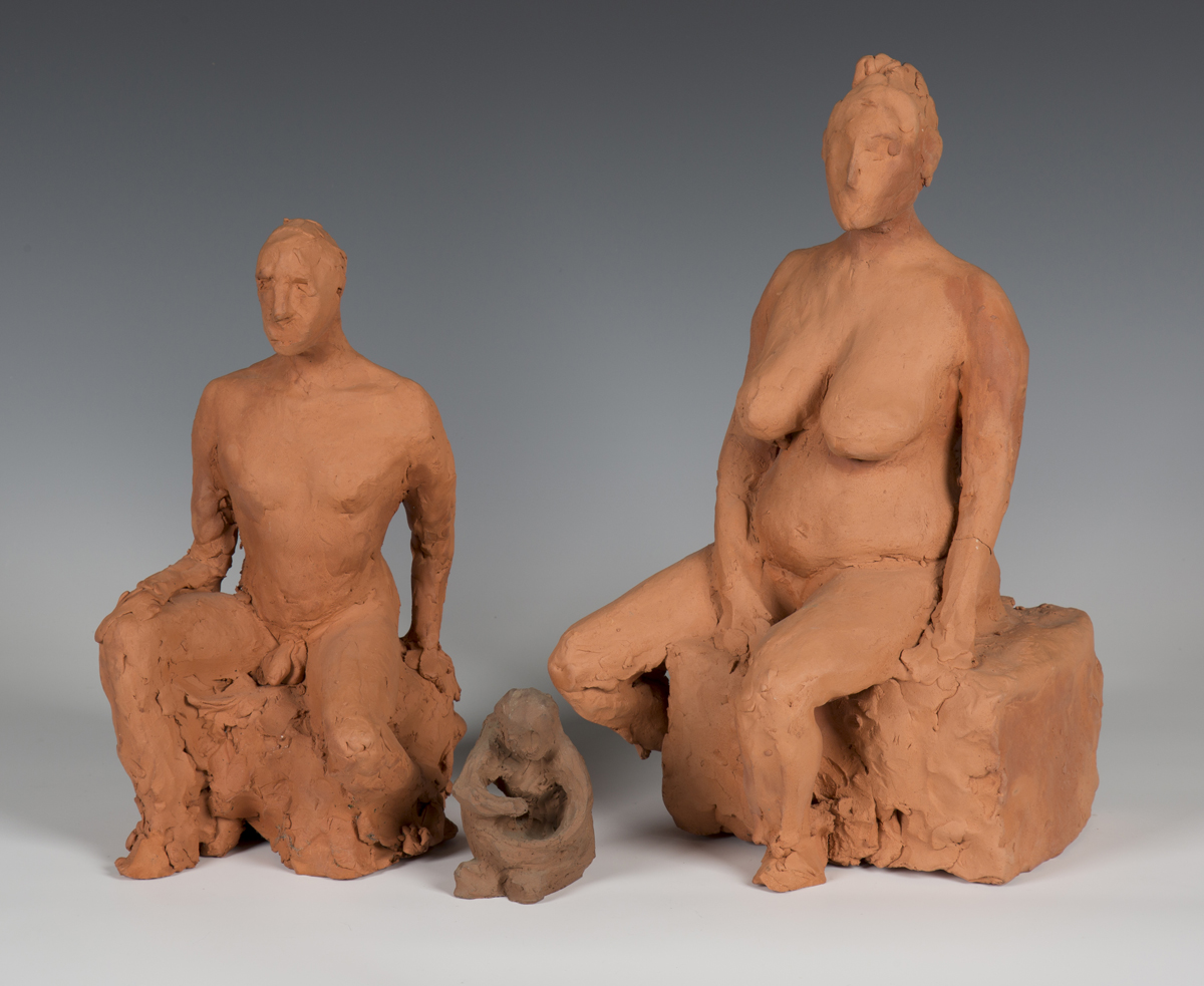A group of three mid-20th century sculpted terracotta maquette models of seated nudes, height of