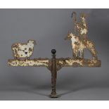 A substantial early 20th century sheet iron weather vane, fret cut and painted in the form of a