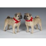 A pair of late 20th century North Light Wade cast resin models of standing pugs, height 30cm.Buyer’s