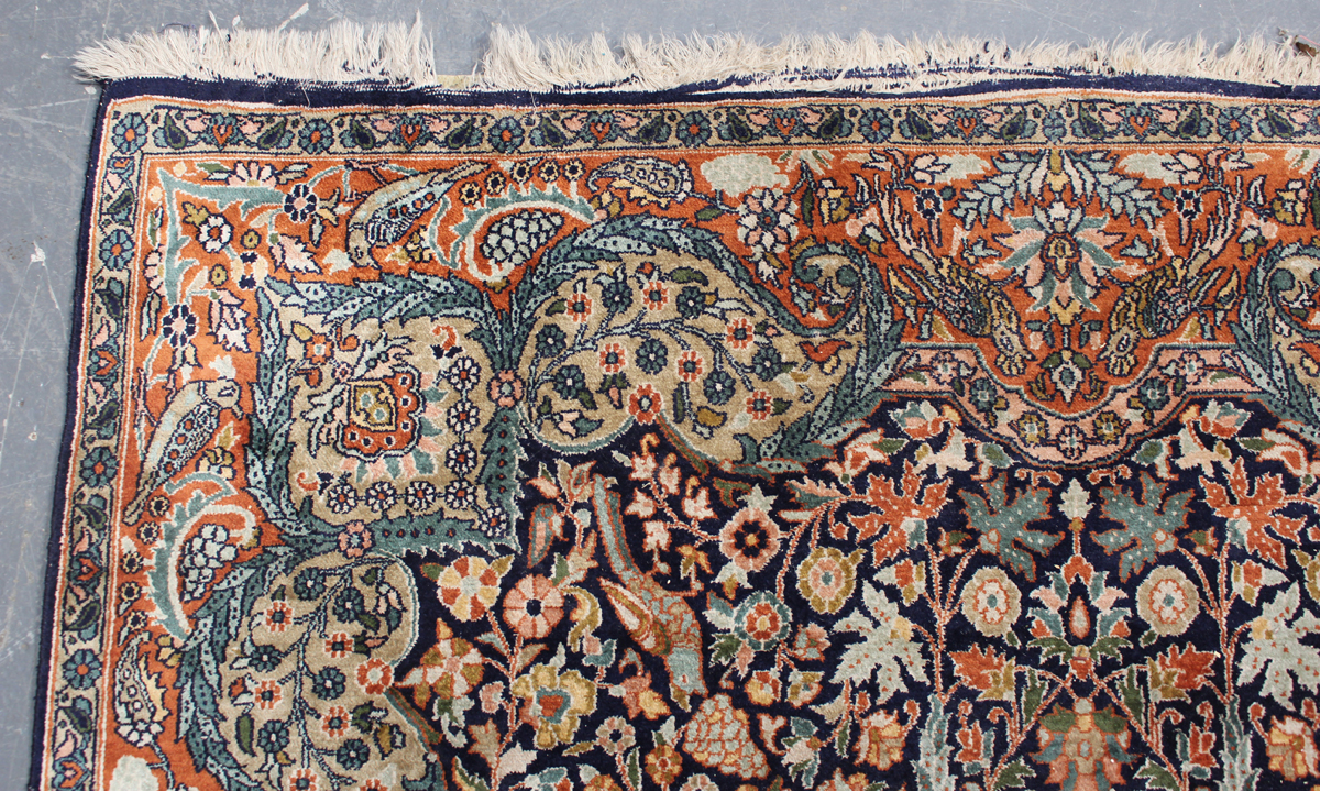 A Turkish part silk rug, late 20th century, the midnight blue field with a flowerhead medallion, - Image 3 of 4