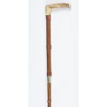 A late 19th/early 20th century carriage whip with stag antler handle, length 110cm.Buyer’s Premium