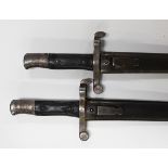 Two Portuguese 1886 model bayonets, blade lengths 46.5cm an 47cm, both inscribed to back of blades