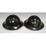 A Second World War period composite material Brodie pattern helmet, height 13cm, together with a