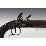 An early 19th century flintlock duelling pistol by Tomlinson of Dublin, with octagonal steel barrel,