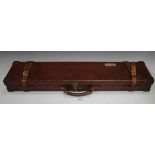 An early 20th century leather and brass bound gun case, the interior with label detailed 'William