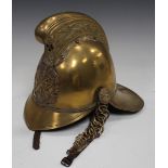 A late 19th/early 20th century brass Merryweather type fireman's helmet with dragon decorated combe,