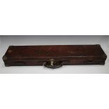 A late 19th century leather and brass bound gun case, the interior with label detailed 'Alexander