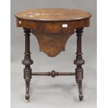 A late Victorian burr walnut and boxwood inlaid oval work table, raised on carved cabriole legs,