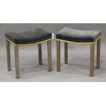 A pair of Elizabeth II limed oak coronation stools, the dished seats covered in blue velvet, the