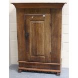 An 18th century Continental oak side cupboard, the moulded pediment above a rectangular panelled