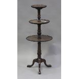 A 20th century George III style mahogany three-tier dumb waiter of small proportions, each level