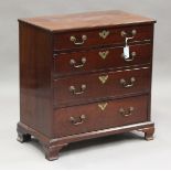 A small George III mahogany bachelor's chest of four graduated oak-lined drawers, raised on ogee