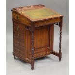 A late Victorian walnut Davenport by R & J Waterer & Son, Chertsey, the hinged writing slope above