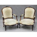 A pair of 19th century French rosewood framed fauteuil armchairs, raised on foliate carved