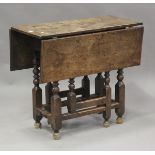 An 18th century provincial oak rectangular gateleg supper table, on turned and block legs, height