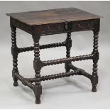 A Charles I oak joined box-top table, the hinged lid above a channelled frieze carved with a band of