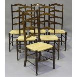 A set of six late 20th century stained beech Quaker style chairs with rush seats, height 110cm,