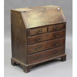 A small George III mahogany bureau, the fall flap above two short and three long drawers with