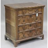 A William and Mary oak chest of four drawers, the front with applied geometric mouldings, raised