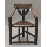 A late Victorian oak and ash Warwick design turner's chair, the chip carved back rest above bobbin