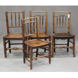 A harlequin set of four mid-19th century provincial ash spindle back chairs with recess panelled