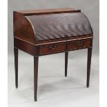 A George IV mahogany tambour-fronted writing desk, the fall front enclosing a pull-out writing