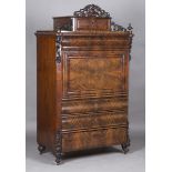 A mid-19th century Continental flame mahogany escritoire, fitted with five shaped drawers and a