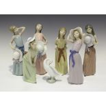 Six Lladro porcelain figures of young women with hats, including Naughty Girl, No. 5006, Bashful,