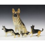 Five Beswick models of Alsatians, Nos. 969, 1762A, 1762B, 2410 and 3073, together with a group of