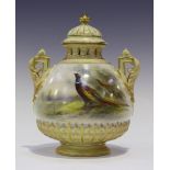 A Royal Worcester porcelain potpourri vase, liner and cover, circa 1910, the bulbous body painted by