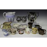 A small group of Staffordshire pottery jugs, mugs and beakers, 19th century, including a lilac