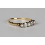 A gold ring, mounted with two cushion cut diamonds alternating with three half-pearls, detailed '
