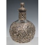 An early 20th century Chinese silver mounted clear glass bottle and stopper, embossed with peonies