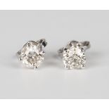A pair of 18ct white gold and diamond single stone earstuds, each claw set with a circular cut