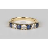 An 18ct gold, sapphire and diamond seven stone half-hoop ring, mounted with four circular cut