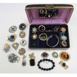 A collection of costume jewellery, the majority brooches, with some of Scottish Celtic design.
