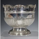 A George V silver Monteith style rose bowl with scroll rim, the half-reeded body with two vacant