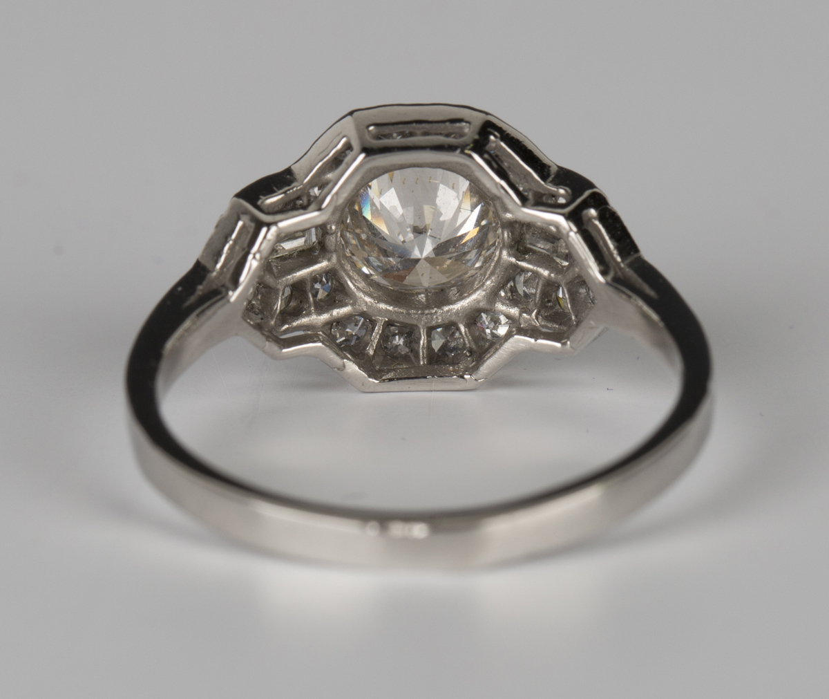 A platinum and diamond ring, collet set with the principal circular cut diamond in a geometric - Image 2 of 4