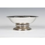 A George V Liberty & Co 'Cymric' silver bowl, model number '50221', the hammered circular body