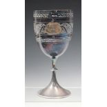 A Victorian silver goblet, the ovoid bowl engraved with a crest and foliate bands, on a beaded