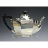 A George V silver teapot of octagonal form with faceted scroll spout, Birmingham 1928 by W.F.