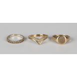 A 9ct gold oval signet ring with engraved monogram, a 9ct gold wishbone shaped ring and a silver and