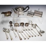 A small collection of silver and plated items, including a silver sauce boat, Sheffield 1933, two