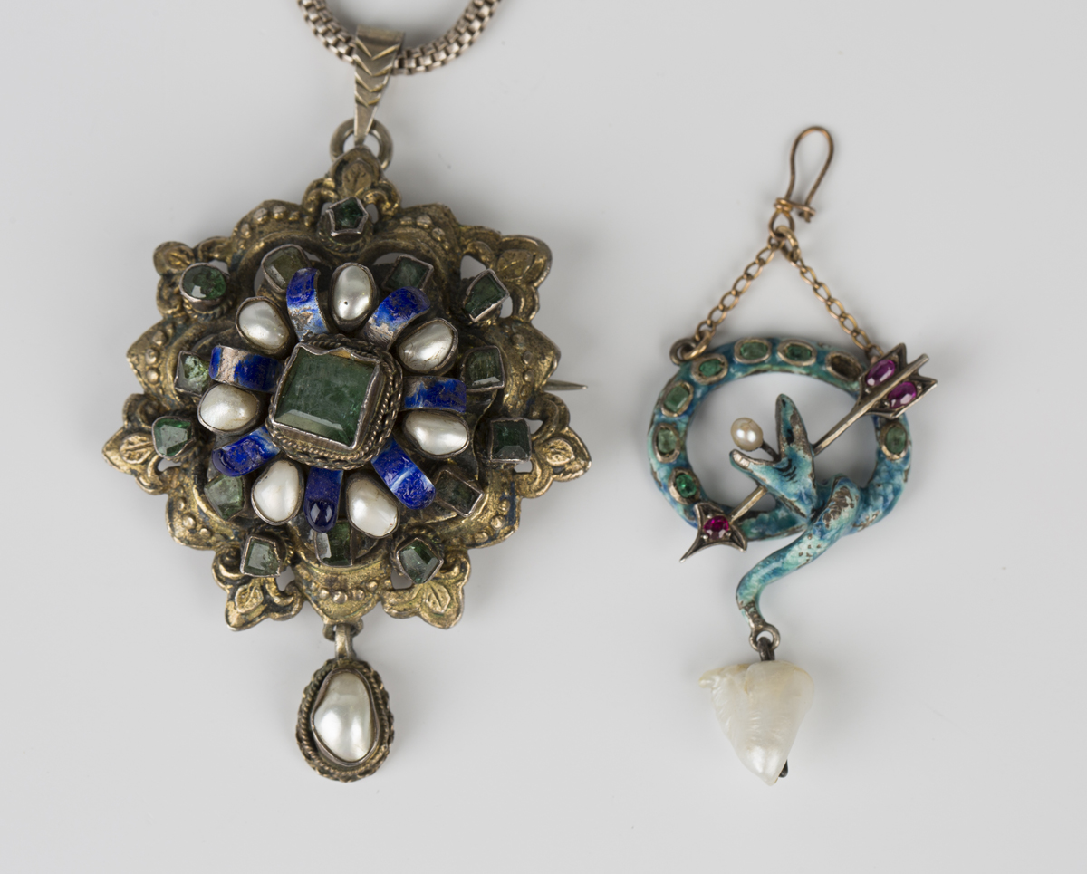 An emerald, blister pearl and enamelled shaped circular gilt pendant brooch, probably Austro-