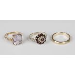 A gold ring, claw set with a rectangular step cut amethyst, detailed '9ct', ring size approx O, a