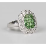 An 18ct white gold, tsavorite and diamond cluster ring, mounted with twenty tsavorites within a
