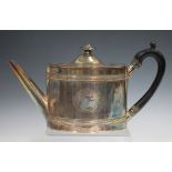 A George III silver teapot, the oval body with reeded bands and bright cut engraved decoration,