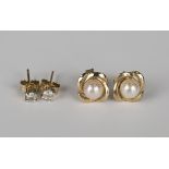 A pair of 9ct gold and diamond single stone earstuds with post and butterfly clip fittings, a pair