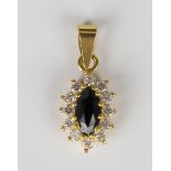 A 22ct gold, sapphire and colourless gem set marquise shaped cluster pendant, length 2.2cm.Buyer’s