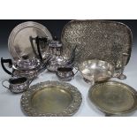 A collection of plated items, including an oval shell patterned tray, a three-piece tea set and an